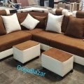 Corner sofa with pillows and puffy