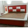 wooden bed without mattress